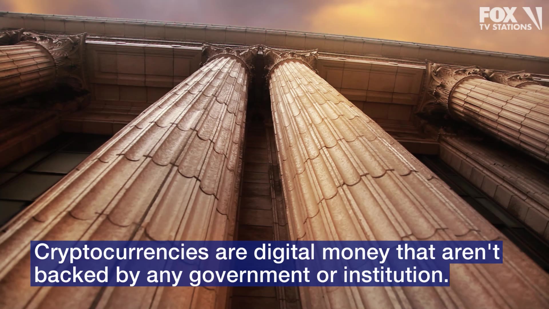 "Looking up at two imposing architectural columns with decorative details, under a cloudy sky, accompanied by text explaining that cryptocurrencies are digital money not backed by any government or institution."