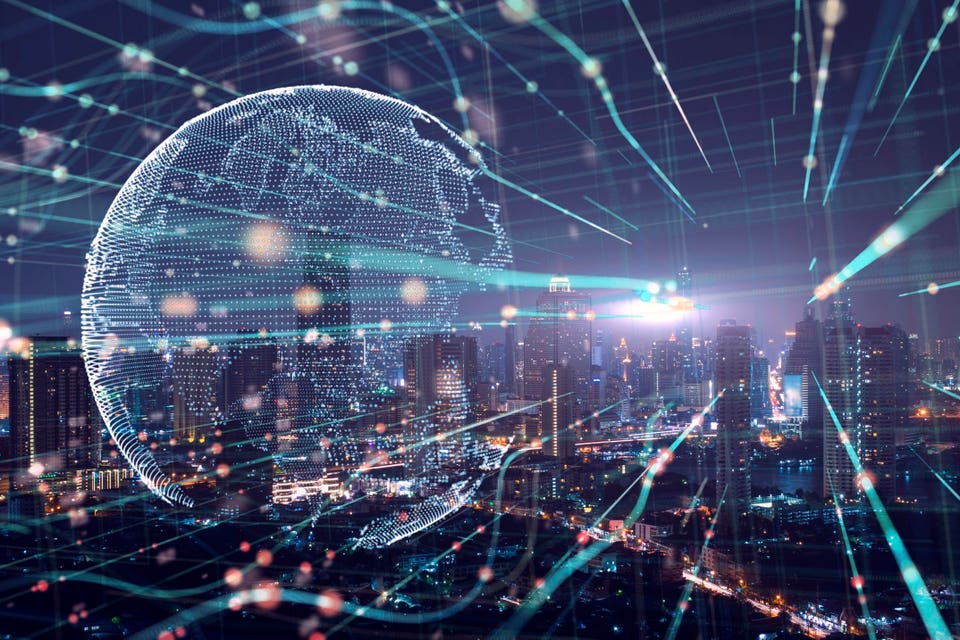 Digital globe with glowing data lines over a city skyline at night.