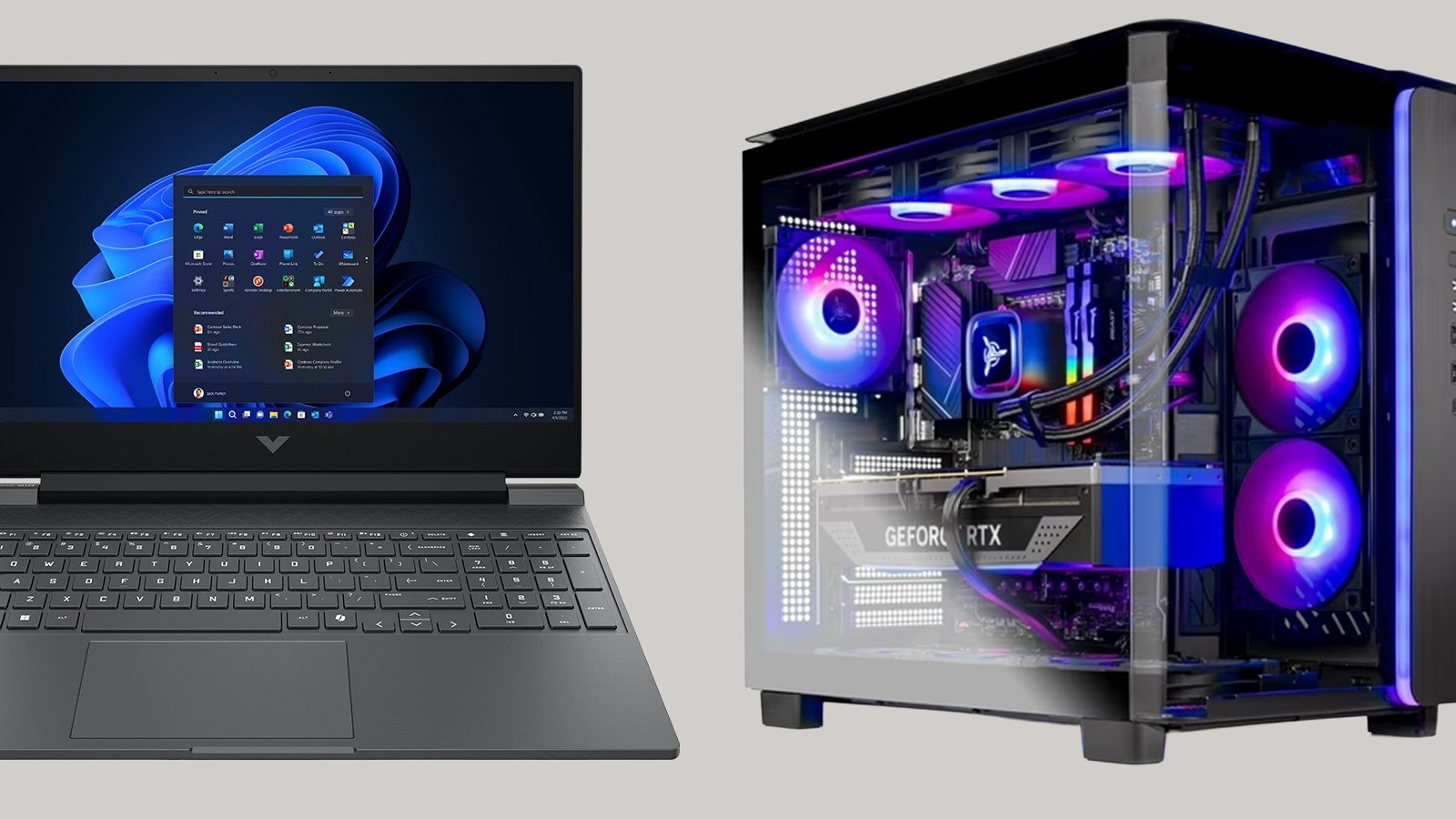 Dark gray laptop displaying Windows 11 Start menu alongside a desktop PC with RGB lighting in a transparent case.