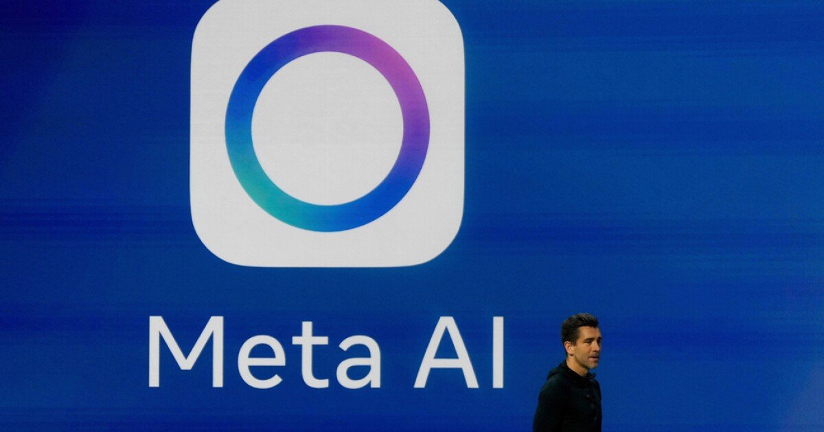 A man stands in front of a blue screen displaying the Meta AI logo, a white rounded square with a colorful gradient circle, and the text "Meta AI."