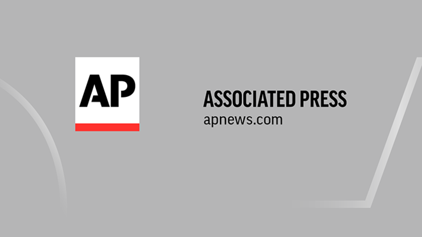 Associated Press (AP) logo featuring black "AP" letters on a white square with a red bar, alongside the text "ASSOCIATED PRESS" and "apnews.com".